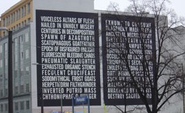 Black/death metalo tekstai papuošė pastato sieną Berlyno centre
